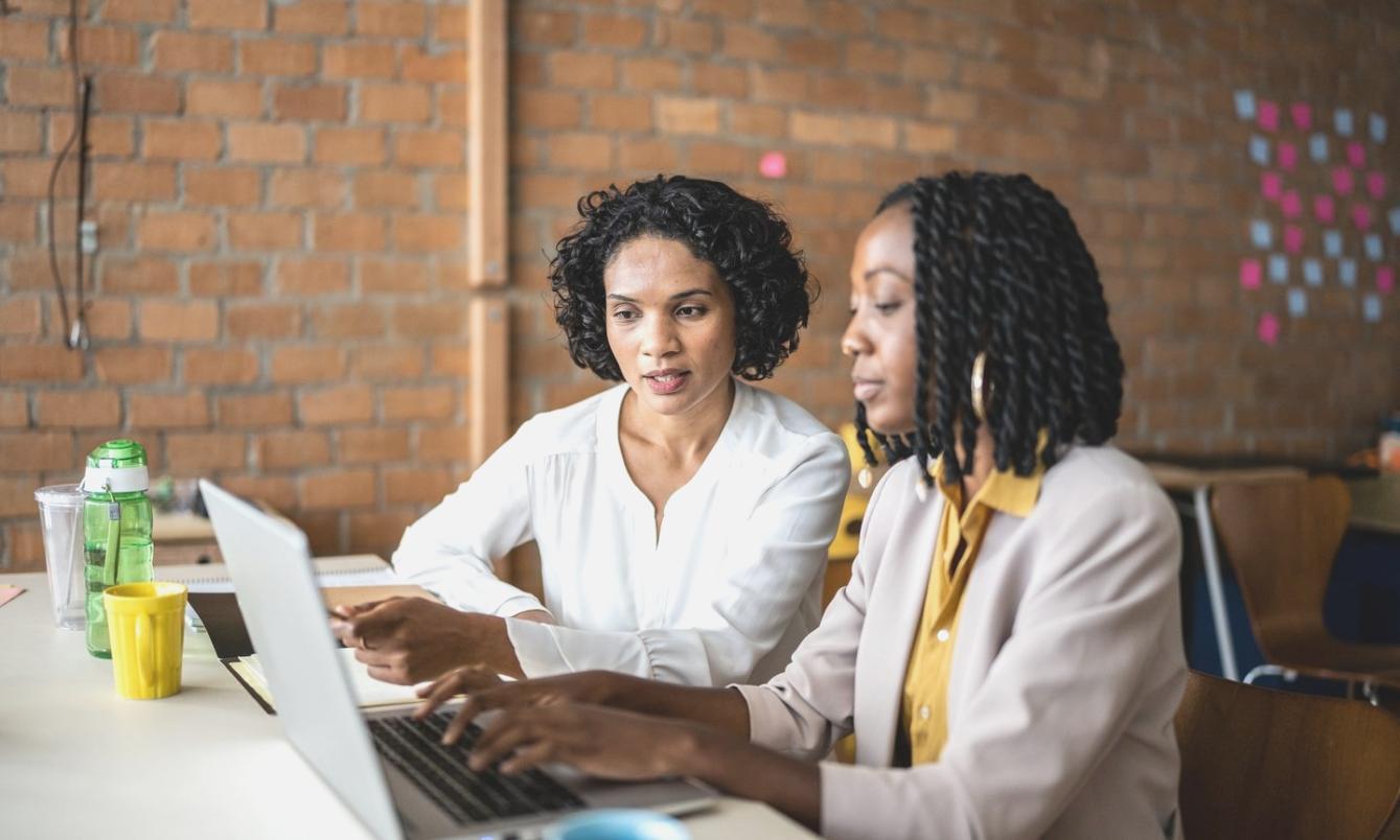 Professional financial planning session with documents and calculator